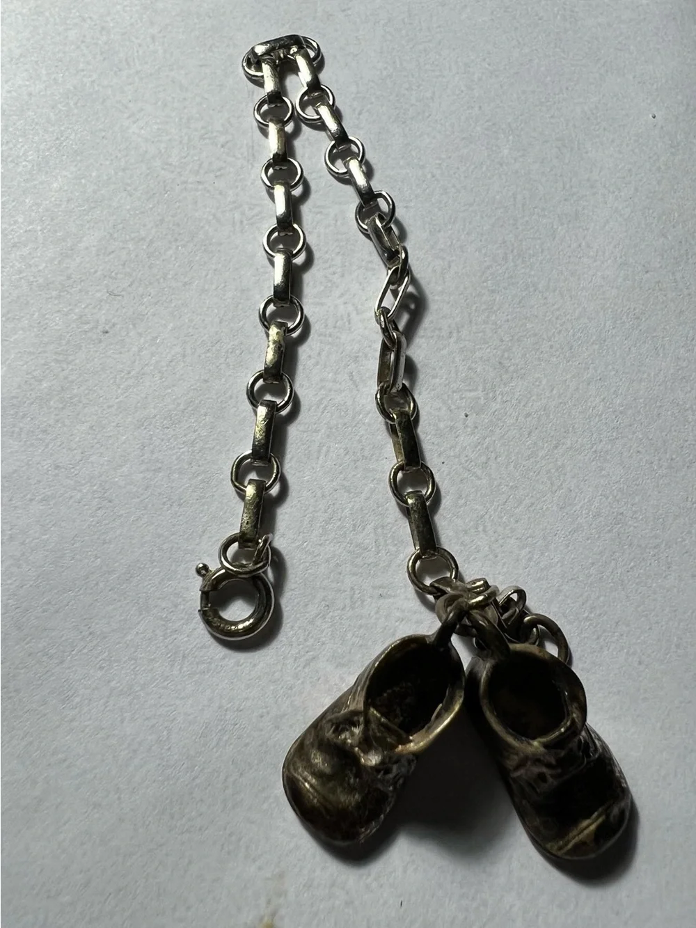 Sterling Silver charm bracelet with silver baby shoes charms
